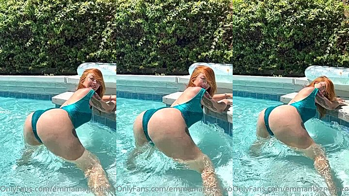 Emma Magnolia shaking her ass in an outdoor pool with swimsuit