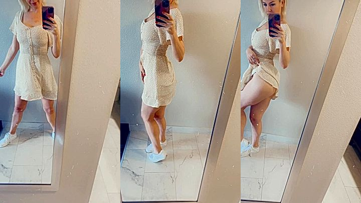 busty milf shows off big ass in front of the miror