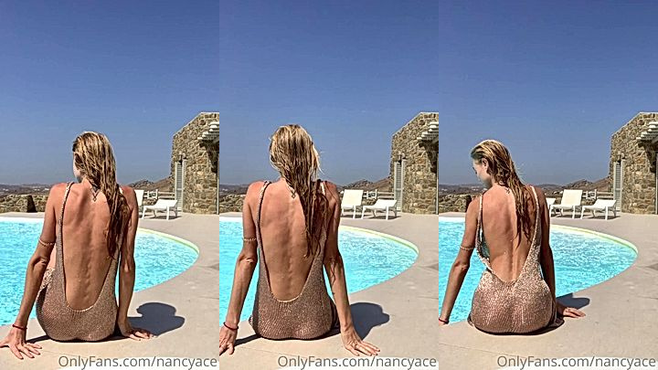 Nancy Ace sitting next to the pool